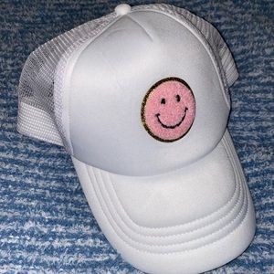 Pink smiley hat trucker hat